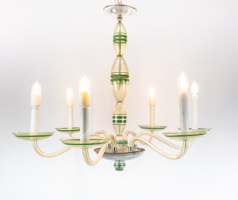 Chandelier of opaline glass decorated with green colours.
