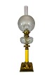 Kerosene lamp of brass with white opaline glass shade and yellow glass stem, 
from around the 1860s. 
Great condition
