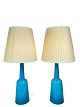 A pair of table lamps of blue opaline glass manufactured by Kastrup Glass 
Factory from around the 1950s. 
5000m2 showroom.
Great condition
