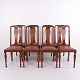 Ensemble de 8 chaises de salle à manger en bois foncé et cuir rouge des années 1920